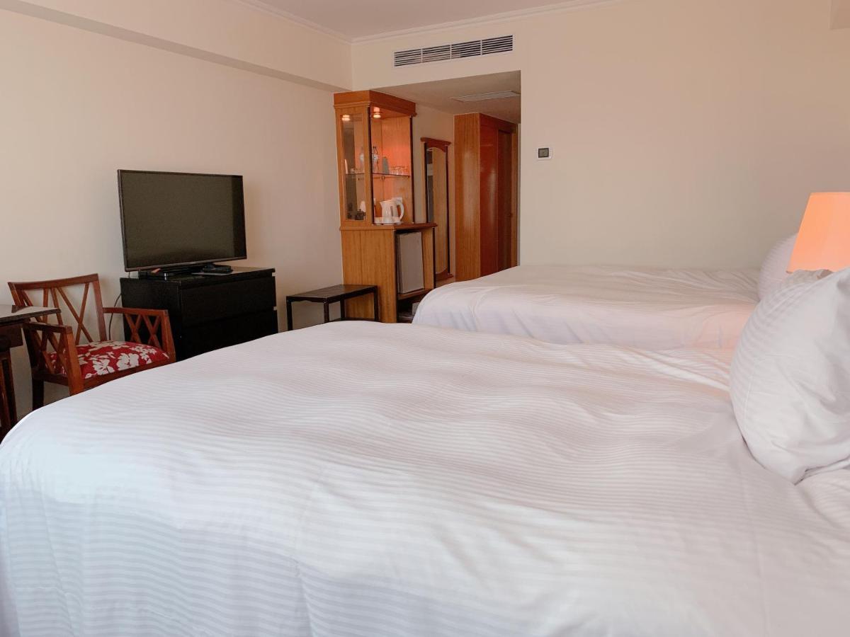 The Howard Plaza Hotel Kaohsiung Bagian luar foto A room at the hotel
